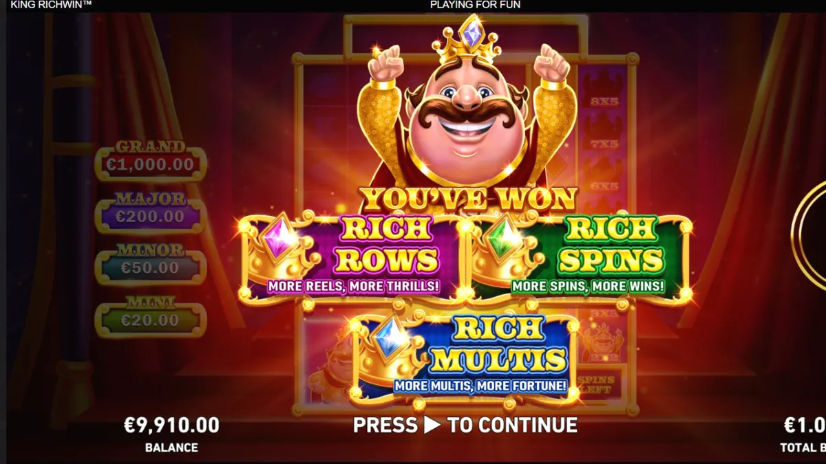 King Richwin slot game interface na may mga makukulay na simbolo at medieval castle background.
